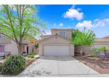 Charming two-story home featuring a two-car garage and well-maintained landscaping in a residential neighborhood at 6217 Lone Cypress Ct, Las Vegas, NV 89141