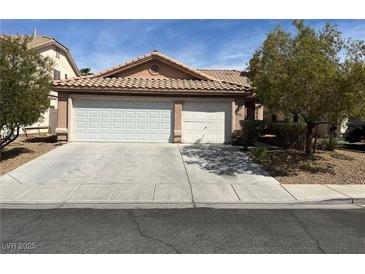 Charming single-story home with a three-car garage and well-maintained landscaping at 9436 Silvaner Ct, Las Vegas, NV 89123