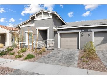 Charming single-story home with well-maintained landscaping and a two-car garage at 1174 King Lark St, Henderson, NV 89011