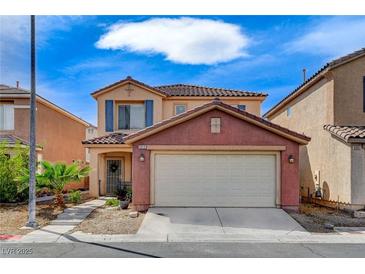 Inviting two-story home with a tile roof, stucco facade, and a well-manicured front yard at 5513 Nickel Ridge Way, Las Vegas, NV 89122