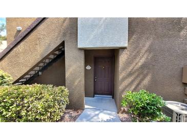 Inviting front entrance featuring a walkway, trimmed bushes, and access stairs to the upper levels at 9000 Las Vegas Blvd # 1133, Las Vegas, NV 89123