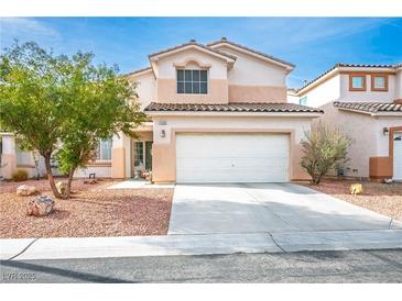 Charming two-story home with a well-maintained front yard and a two-car garage at 1163 Regal Lily Way, Las Vegas, NV 89123