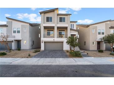 Contemporary two-story home with a well-manicured front yard and attractive architectural details at 5745 Becklow Gardens Ave, Las Vegas, NV 89141