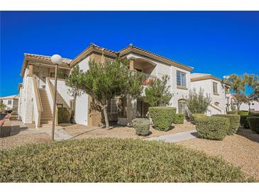 Charming condo featuring a stucco exterior with landscaped grounds, perfect for relaxed living at 6901 Squaw Mountain Dr # 201, Las Vegas, NV 89130