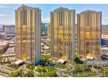 Stunning exterior view of MGM Signature towers with lush landscaping and circular driveway at 135 E Harmon Ave # 3704, Las Vegas, NV 89109