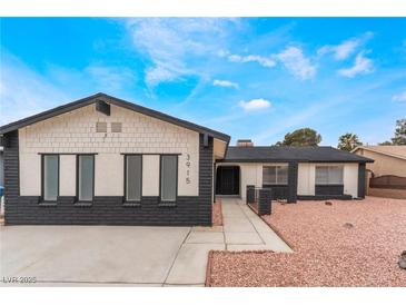 Charming single-story home featuring a unique exterior, well-manicured yard, and inviting entrance at 3915 Delling Ct, Las Vegas, NV 89104
