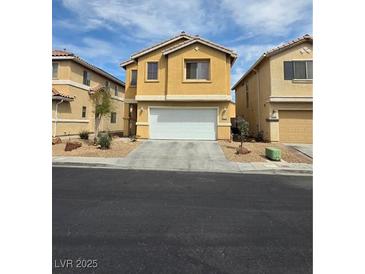 Charming two-story home featuring neutral color palette, a two-car garage, and low maintenance landscaping at 6476 Ness Gardens Ct, Las Vegas, NV 89122
