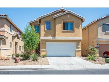 Charming two-story home featuring a two-car garage and low maintenance desert landscaping at 6476 Ness Gardens Ct, Las Vegas, NV 89122