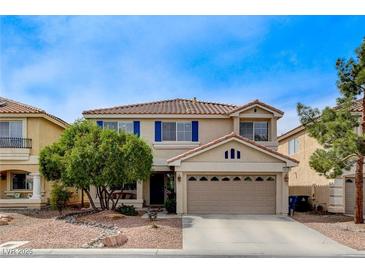 Charming two-story home with a well-maintained front yard and desert landscaping at 10657 Medicine Bow St, Las Vegas, NV 89183
