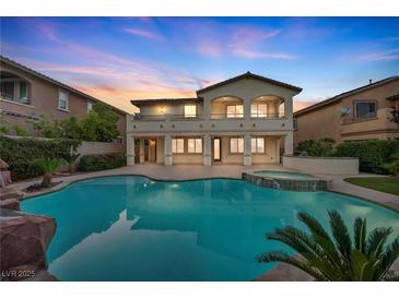 Stunning backyard pool and spa, complete with a waterfall and beautiful landscaping at 12283 Lost Treasure Ave, Las Vegas, NV 89138