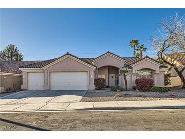 Charming single-story home featuring a three-car garage and well-maintained desert landscaping at 225 Deer Crossing Way, Henderson, NV 89012