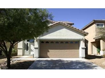Charming single-Gathering home with a well-manicured lawn and a two-car garage at 3883 Winter Whitetail St, Las Vegas, NV 89122