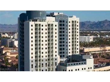 Modern exterior of The Platinum Hotel and Spa, showcasing its architecture and surrounding landscape with views of the mountains at 211 E Flamingo Rd # 1011, Las Vegas, NV 89169