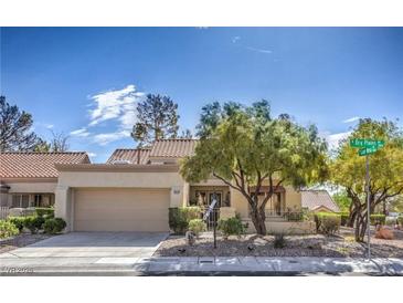 Charming single-story home with a desert landscape, attached garage, and welcoming curb appeal at 2824 Dry Plains Dr, Las Vegas, NV 89134