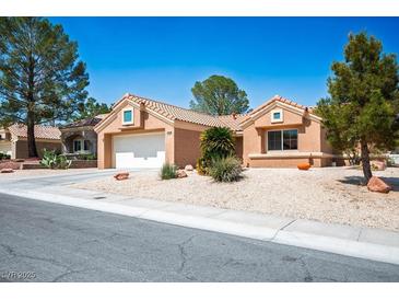 Charming single-story home featuring a two-car garage, low-maintenance landscaping, and a welcoming entrance at 9536 Ruby Hills Dr, Las Vegas, NV 89134