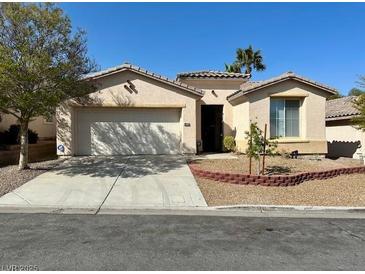 Charming single-story home boasts a well-maintained front yard and a welcoming facade at 10516 Angel Dreams Ave, Las Vegas, NV 89144