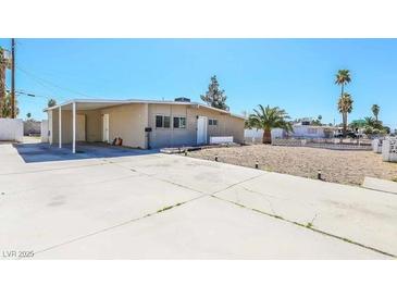 Charming single-story home featuring a spacious driveway and minimalist desert landscaping at 2990 La Canada St, Las Vegas, NV 89169