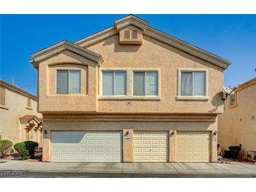 Beige two-story home with a three-car garage and well-kept facade at 6404 Extreme Shear Ave # 103, Henderson, NV 89011