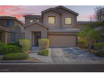 Charming two-story home featuring desert landscaping, covered entry, and attached two-car garage at 7900 Eastern Elk St, Las Vegas, NV 89149