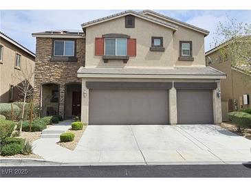 Charming two-story home with a three-car garage and stone accents at 8088 Smoking Jacket Pl, Las Vegas, NV 89166