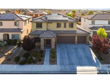 Beautiful two-story home with solar panels and a spacious three-car garage, plus desert landscaping at 8112 Sapphire Sea St, North Las Vegas, NV 89085