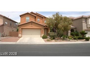 Charming two-story home with a well-maintained front yard and an attached two-car garage at 6528 Chebec St, North Las Vegas, NV 89084