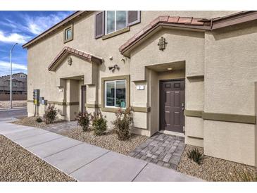Inviting townhome with a private entrance and desert landscaping at 7900 Pandora Sky St # 262, North Las Vegas, NV 89084