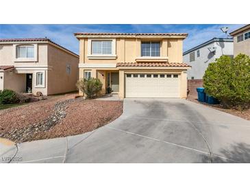 Inviting two-story home featuring a two-car garage and low maintenance front yard at 8407 Kettledrum St, Las Vegas, NV 89139