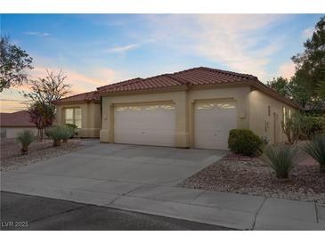 Charming single-story home with a two-car garage and well-maintained desert landscaping at 10201 Los Padres Pl, Las Vegas, NV 89134