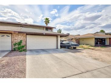 Charming two-story townhome with a two-car garage and desert landscaping at 3939 Jontue St, Las Vegas, NV 89115