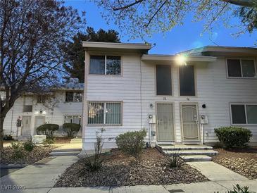 Charming townhouse featuring a well maintained lawn and inviting front entrances at 4770 Topaz St # 73, Las Vegas, NV 89121