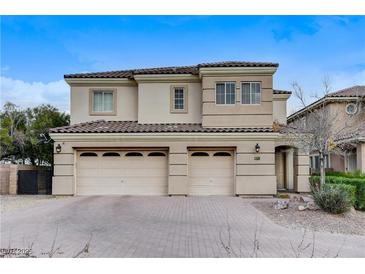 Charming two-story home featuring a three-car garage and well-maintained front yard at 5588 Holcomb Bridge Ct, Las Vegas, NV 89149