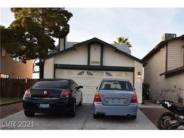 Modest single-Gathering home featuring a two-car garage and clean, inviting curb appeal on a sunny day at 6732 Accent Ct, Las Vegas, NV 89108