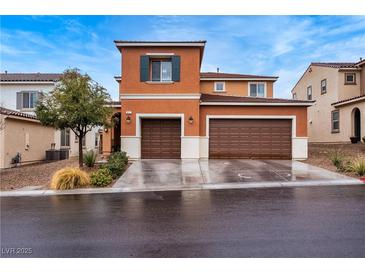 Charming two-story home featuring a two car garage and beautiful desert landscaping at 817 Great Sky Ct, North Las Vegas, NV 89084