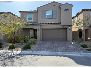 Charming two-story home features a landscaped front yard and a convenient two-car garage at 8675 Principato St, Las Vegas, NV 89166