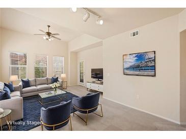 Bright living room featuring a comfortable seating area, modern decor, and ample natural light at 10550 W Alexander Rd # 2017, Las Vegas, NV 89129