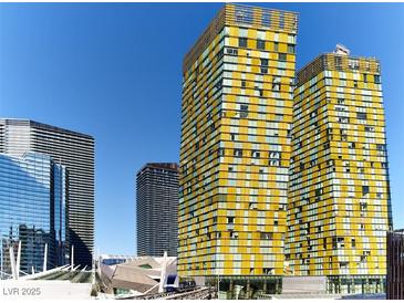 Las Vegas high-rise buildings feature colorful exterior design against a clear blue sky backdrop at 3726 Las Vegas Blvd # 2504, Las Vegas, NV 89158