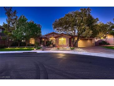 Charming single story home showcasing mature trees and a manicured front yard at 4 Dry Brook Trl, Henderson, NV 89052