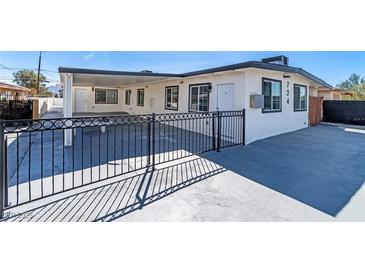 Charming home featuring updated windows, fresh paint, and an appealing fence for added curb appeal at 724 N 9Th St, Las Vegas, NV 89101