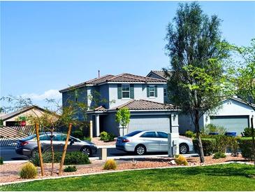 Charming two-story home with landscaped yard and a two-car garage at 8694 Glen Echo Ave, Las Vegas, NV 89148