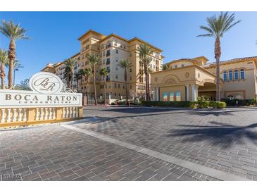 Beautiful condominium complex, Boca Raton, with attractive landscaping and elegant entrance at 2405 W Serene Ave # 236, Las Vegas, NV 89123