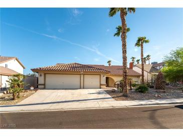 Charming single-story home featuring a spacious three-car garage and desert landscaping at 6509 Vicuna Dr, Las Vegas, NV 89146