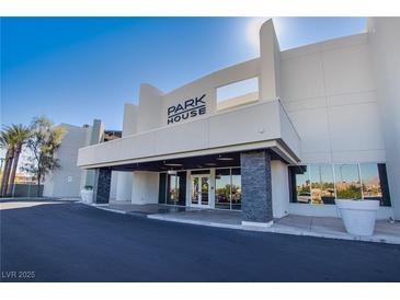 Modern building exterior with 'Park House' signage, sleek architectural details, and a covered entrance at 8925 W Flamingo Rd # 228, Las Vegas, NV 89147