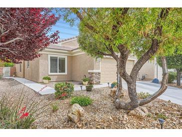 Charming single-story home with desert landscaping, mature trees and great curb appeal at 2324 Willow Wren Dr, North Las Vegas, NV 89084