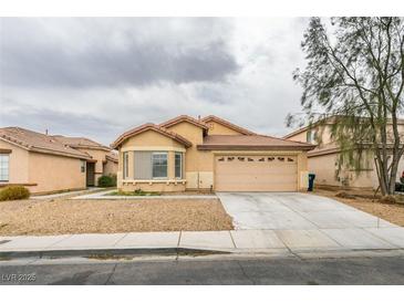 Inviting single-story home with a low-maintenance front yard and an attached two-car garage at 4417 Gracemont Ave, Las Vegas, NV 89139