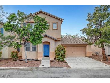 Charming two-story home featuring a blue front door and attached two car garage at 2649 Heathrow St, Las Vegas, NV 89135