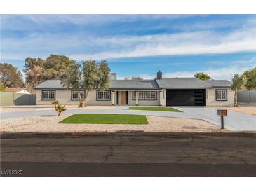 Charming single story home featuring a well-manicured front yard, gravel landscaping, and a spacious driveway at 2749 Horseshoe Dr, Las Vegas, NV 89120