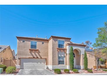 Charming two-story home with a two-car garage and well-maintained landscaping at 3525 Dover Bay St, Las Vegas, NV 89129