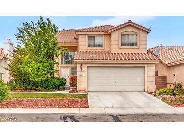 Charming two-story home featuring a terracotta roof, a well-manicured lawn, and a spacious two-car garage at 3735 Morning Canyon St, Las Vegas, NV 89147