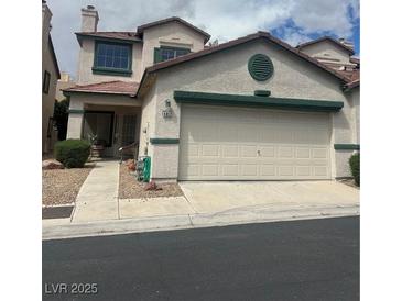 Two-story home with stucco exterior, red tile roof, and two-car garage at 4017 Radbourne Ave, Las Vegas, NV 89121
